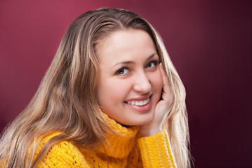 Image showing Perfect blonde on red background