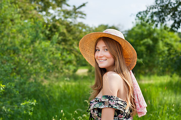 Image showing Young beautiful girl with hat posing outdoor