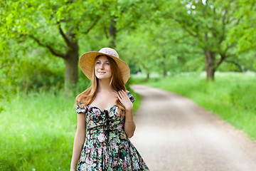 Image showing Young beautiful girl with hat posing outdoor