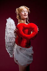 Image showing Perfect blonde angel with a red heart