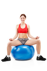 Image showing woman exercising on an exercise ball