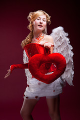 Image showing Perfect blonde angel with a red heart