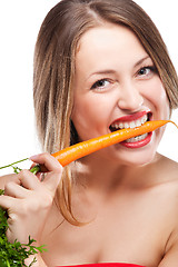 Image showing blonde woman eating carrot