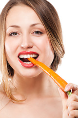 Image showing blonde woman eating carrot