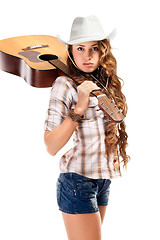 Image showing Sesy cowgirl in cowboy hat with acoustic guitar