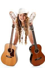 Image showing Sesy cowgirl in cowboy hat with acoustic guitar