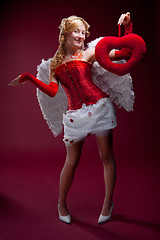 Image showing Perfect blonde angel with a red heart