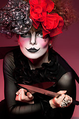 Image showing woman mime with knife