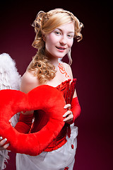 Image showing Perfect blonde angel with a red heart