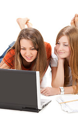 Image showing two young happy student girl work on laptop