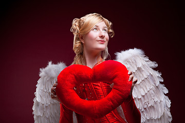 Image showing Perfect blonde angel with a red heart