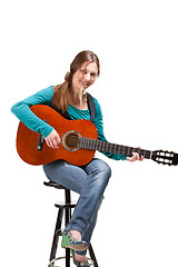 Image showing cowgirl in ahat with acoustic guitar