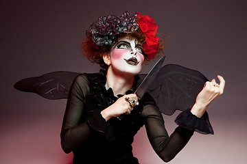 Image showing woman mime with knife