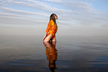 Image showing girl posing in the Water at sunset