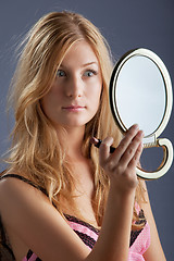 Image showing beautiful woman with mirror