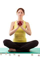 Image showing woman in sportswear with apple