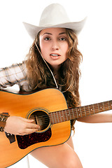 Image showing Sesy cowgirl in cowboy hat with acoustic guitar