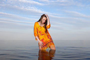 Image showing girl posing in the Water at sunset