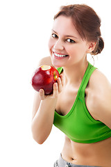 Image showing woman in sportswear with apple