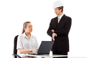 Image showing Two businesspeople working with laptop