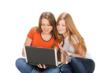 Image showing two young happy student girl work on laptop