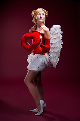 Image showing Perfect blonde angel with a red heart