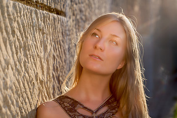 Image showing Young woman outdoors at sunset