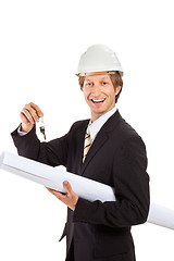 Image showing smiling engineer giving keys from apartment