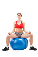 Image showing woman exercising on an exercise ball