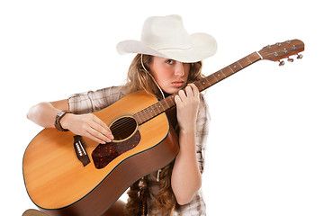 Image showing Sesy cowgirl in cowboy hat with acoustic guitar