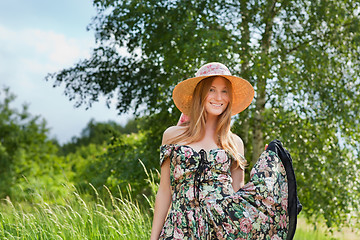 Image showing Young beautiful girl with hat posing outdoor