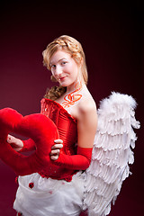 Image showing Perfect blonde angel with a red heart