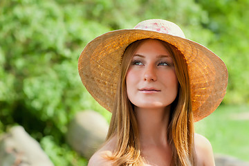 Image showing Young beautiful girl with hat posing outdoor