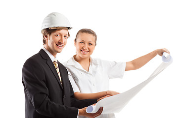 Image showing An architect wearing a hard hat and co-worker