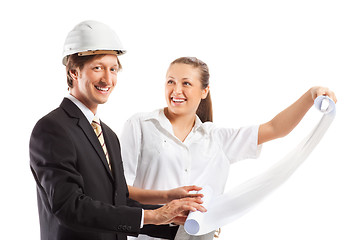 Image showing An architect wearing a hard hat and co-worker