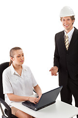 Image showing Two businesspeople working with laptop