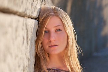 Image showing Young woman outdoors at sunset