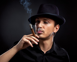 Image showing Gangster look. Man with hat and cigar.