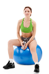 Image showing woman exercising on an exercise ball