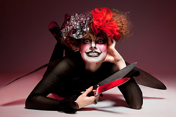 Image showing woman mime with knife