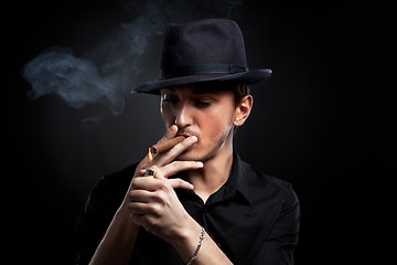 Image showing Gangster look. Man with hat and cigar.