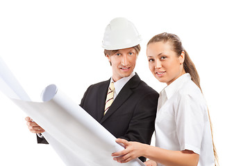 Image showing An architect wearing a hard hat and co-worker