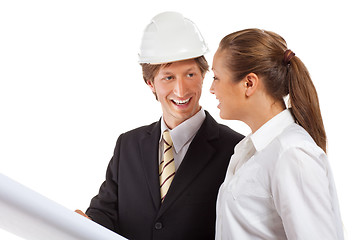 Image showing An architect wearing a hard hat and co-worker