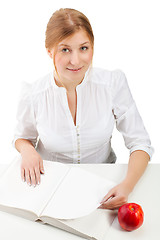 Image showing woman with apple and book