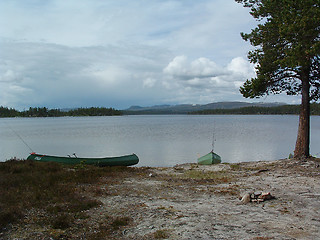 Image showing Canoe camp by the lake