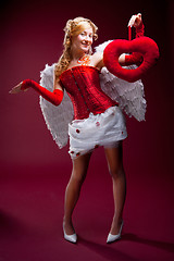 Image showing Perfect blonde angel with a red heart