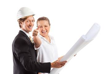 Image showing An architect wearing a hard hat and co-worker