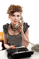 Image showing Businesswoman taking telephone call in office