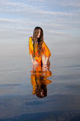 Image showing girl posing in the Water at sunset