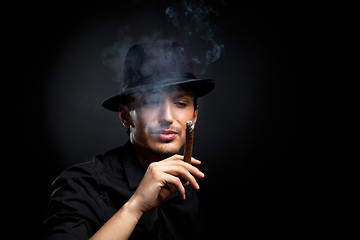 Image showing Gangster look. Man with hat and cigar.